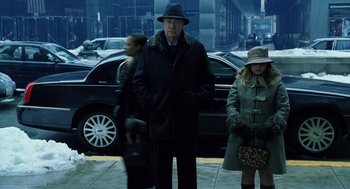 Movie still from “The Weather Man” (2005), directed by Gore Verbinski – A man and a woman are walking down the street; Wide shot, Over the shoulder angle