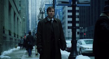 Movie still from “The Weather Man” (2005), directed by Gore Verbinski – A man standing on the sidewalk of a city street; Medium shot, Low angle