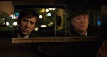 A man and a woman looking out of a train window