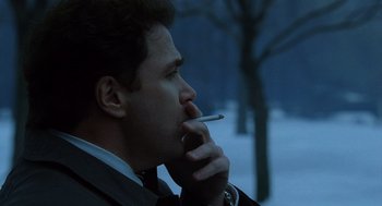 Movie still from “The Weather Man” (2005), directed by Gore Verbinski – A person smoking a cigarette; Close Up shot, Low angle