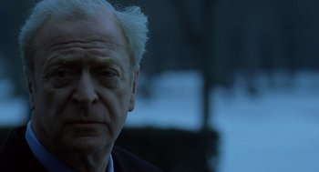 Movie still from “The Weather Man” (2005), directed by Gore Verbinski – An older man with white hair looking into the distance; Close Up shot, Low angle