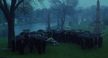Movie still from “The Weather Man” (2005), directed by Gore Verbinski – A group of people standing next to an open casket in a cemetery; Extreme Wide shot, High angle