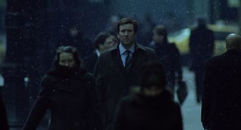 Movie still from “The Weather Man” (2005), directed by Gore Verbinski – A crowd of people walking in the rain; Medium shot, Low angle