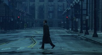 Movie still from “The Weather Man” (2005), directed by Gore Verbinski – A man walking down a street in the rain; Extreme Wide shot, High angle