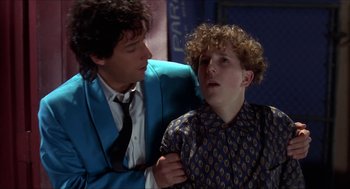 Movie still from “The Wedding Singer” (1998), directed by Frank Coraci – A man in a blue jacket and a boy in a blue jacket; Close Up shot, Over the shoulder angle