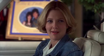 Movie still from “The Wedding Singer” (1998), directed by Frank Coraci – A person sitting in a car; Close Up shot, Over the shoulder angle