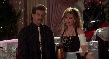 Movie still from “The Wedding Singer” (1998), directed by Frank Coraci – A man and a woman standing next to each other; Medium shot, Low angle