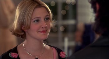Movie still from “The Wedding Singer” (1998), directed by Frank Coraci – A person wearing a necklace; Close Up shot, Over the shoulder angle