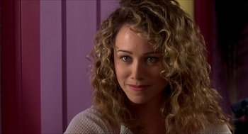 Movie still from “The Wedding Singer” (1998), directed by Frank Coraci – A person with curly hair; Close Up shot, Over the shoulder angle
