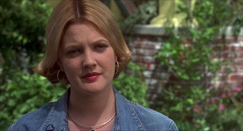 Movie still from “The Wedding Singer” (1998), directed by Frank Coraci – A person wearing a jean shirt; Close Up shot, Over the shoulder angle