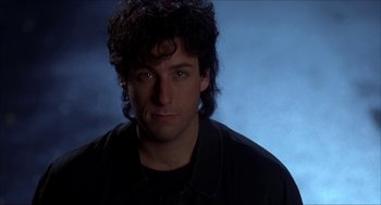 Movie still from “The Wedding Singer” (1998), directed by Frank Coraci – A person wearing a black shirt; Close Up shot, Low angle