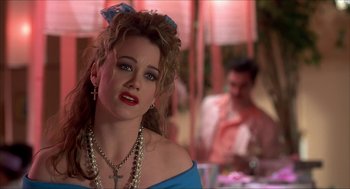 Movie still from “The Wedding Singer” (1998), directed by Frank Coraci – A person wearing a necklace; Close Up shot, Over the shoulder angle