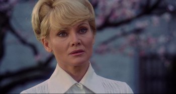 Movie still from “The Wicker Man” (1973), directed by Robin Hardy – A person wearing a white shirt; Close Up shot, Low angle