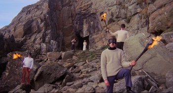 Movie still from “The Wicker Man” (1973), directed by Robin Hardy – A group of people standing on top of a mountain; Wide shot, High angle