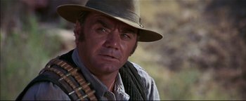 Movie still from “The Wild Bunch” (1969), directed by Sam Peckinpah – A person wearing a hat; Close Up shot, Low angle