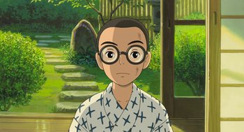 Movie still from “The Wind Rises” (2013), directed by Hayao Miyazaki – An animated person wearing glasses and a robe; Close Up shot, High angle