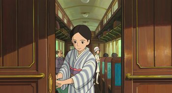 Movie still from “The Wind Rises” (2013), directed by Hayao Miyazaki – An animated picture of a woman in a train; Medium shot, High angle