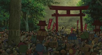 Movie still from “The Wind Rises” (2013), directed by Hayao Miyazaki – A crowd of people sitting in front of a red gate; Extreme Wide shot, High angle