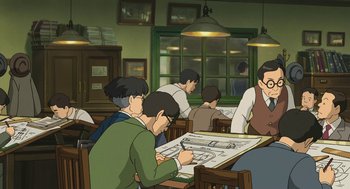 Movie still from “The Wind Rises” (2013), directed by Hayao Miyazaki – A group of people sitting at tables in a room; Wide shot, High angle