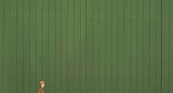 Movie still from “The Wind Rises” (2013), directed by Hayao Miyazaki – A man standing in front of a green wall; Extreme Wide shot, Overhead angle