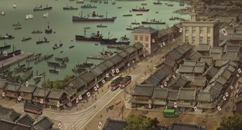 Movie still from “The Wind Rises” (2013), directed by Hayao Miyazaki – An aerial view of a harbor with many boats in the water; Extreme Wide shot, High angle