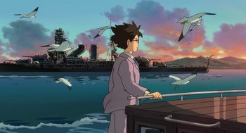 Movie still from “The Wind Rises” (2013), directed by Hayao Miyazaki – A man standing on top of a boat in the water; Wide shot, Low angle