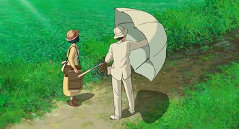 Movie still from “The Wind Rises” (2013), directed by Hayao Miyazaki – A man holding an umbrella and a woman holding an umbrella; Wide shot, High angle