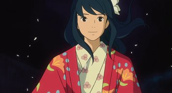 Movie still from “The Wind Rises” (2013), directed by Hayao Miyazaki – A woman in a kimono is smiling for the camera; Medium shot, High angle