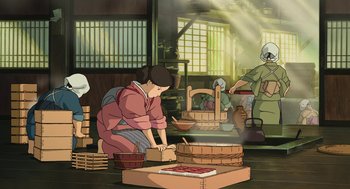 Movie still from “The Wind Rises” (2013), directed by Hayao Miyazaki – An animated scene of a woman making a pizza in a kitchen; Wide shot, High angle