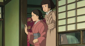 Movie still from “The Wind Rises” (2013), directed by Hayao Miyazaki – Two young women in traditional japanese clothing looking out of a window; Medium shot, Low angle