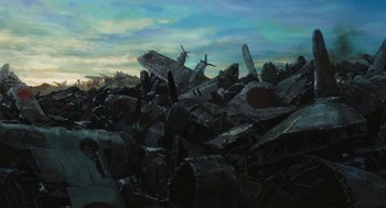 Movie still from “The Wind Rises” (2013), directed by Hayao Miyazaki – A pile of junk sitting on top of a field; Extreme Wide shot, Low angle