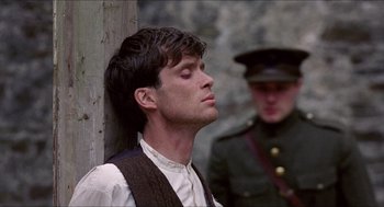Movie still from “The Wind that Shakes the Barley” (2006), directed by Ken Loach – A man in a military uniform and a man in an army uniform; Close Up shot, Low angle