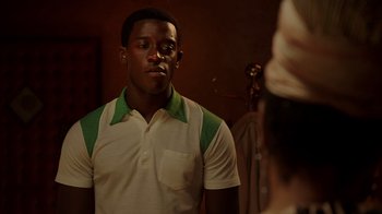 Movie still from “Snowfall” (2017), directed by Hiro Murai – A young man looking at himself in the mirror; Close Up shot, Over the shoulder angle