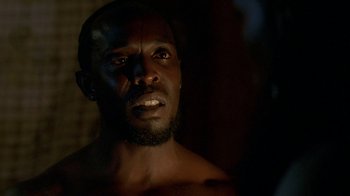 Movie still from “The Wire” (2002), created by David Simon – A person with his mouth wide open; Close Up shot, Low angle