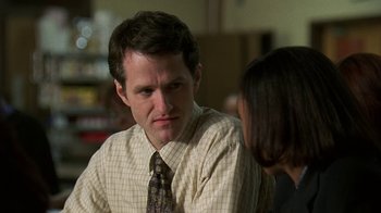Movie still from “The Wire” (2002), created by David Simon – A man and a woman talking to each other; Close Up shot, Over the shoulder angle