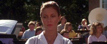 Movie still from “The Witches of Eastwick” (1987), directed by George Miller – A person wearing a white shirt; Close Up shot, Low angle
