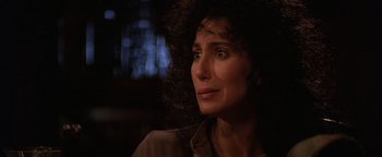 Movie still from “The Witches of Eastwick” (1987), directed by George Miller – A person looking up at the sky; Close Up shot, Over the shoulder angle