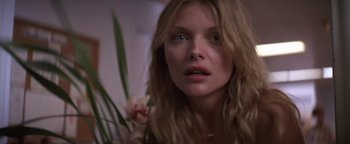 Movie still from “The Witches of Eastwick” (1987), directed by George Miller – A person with long blonde hair; Close Up shot, Low angle