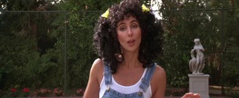 Movie still from “The Witches of Eastwick” (1987), directed by George Miller – A person with a curly hair; Close Up shot, High angle