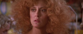 Movie still from “The Witches of Eastwick” (1987), directed by George Miller – A person with red curly hair; Close Up shot, Low angle