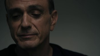 Movie still from “The Wizard of Lies” (2017), directed by Barry Levinson – A man's face with his eyes wide open; Close Up shot, Low angle