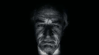 Movie still from “The Wizard of Lies” (2017), directed by Barry Levinson – An old man's face is shown in a black and white photo; Extreme Close Up shot, Low angle