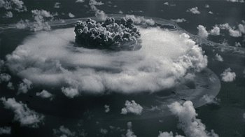 Movie still from “The Wizard of Lies” (2017), directed by Barry Levinson – An aerial view of an explosion in the sky; Extreme Wide shot, High angle
