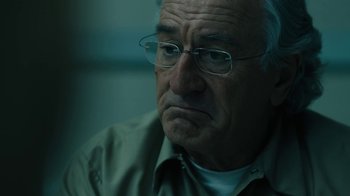 Movie still from “The Wizard of Lies” (2017), directed by Barry Levinson – An older man with glasses is sitting in a room; Close Up shot, Low angle