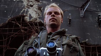 Movie still from “Full Metal Jacket” (1987), directed by Stanley Kubrick – A man in a military uniform is looking at the camera; Close Up shot, Low angle
