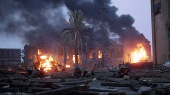 Movie still from “Full Metal Jacket” (1987), directed by Stanley Kubrick – A group of soldiers in the middle of a burning city; Extreme Wide shot, High angle
