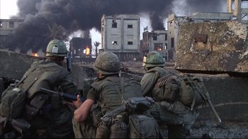 Movie still from “Full Metal Jacket” (1987), directed by Stanley Kubrick – A group of soldiers in the middle of an urban area; Wide shot, High angle