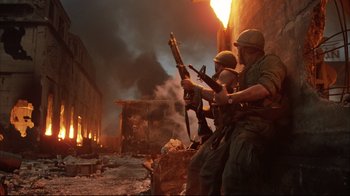 Movie still from “Full Metal Jacket” (1987), directed by Stanley Kubrick – A group of men standing next to each other holding guns; Wide shot, Low angle