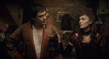 Movie still from “The Wolfman” (2010), directed by Joe Johnston – A man and a woman are standing next to each other; Medium shot, Over the shoulder angle