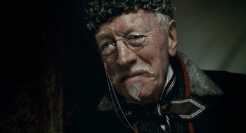 Movie still from “The Wolfman” (2010), directed by Joe Johnston – An old man wearing a hat and a tie; Close Up shot, Low angle